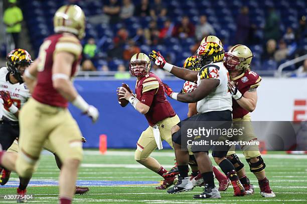 Boston College Eagles quarterback Patrick Towles looks for an open receiver during Quick Lane Bowl game action between the Boston College Eagles and...