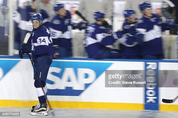 Toronto Maple Leafs center Auston Matthews smiles after scoring his first of the game as the Toronto Maple Leafs beat the Detroit Red Wings 5-4 in...
