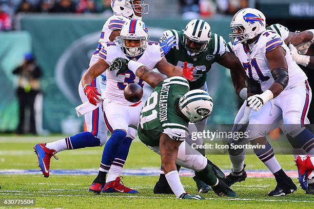 New York Jets defensive end Sheldon Richardson knocks the ball away from Buffalo Bills defensive back Jonathan Dowling during the third quarter of...