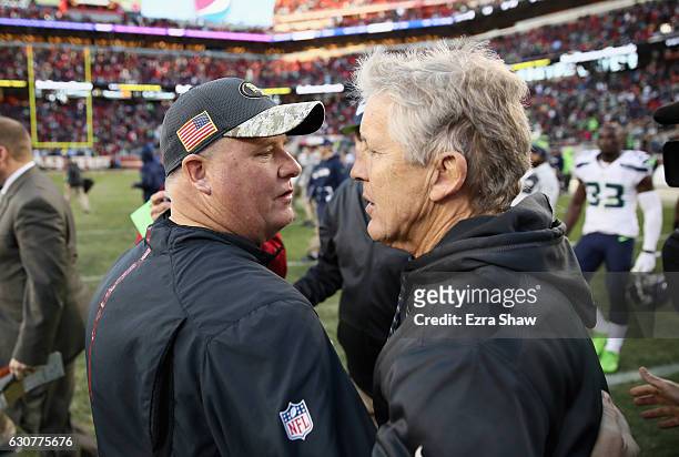 Head coach Pete Carroll of the Seattle Seahawks shakes hands with head coach Chip Kelly of the San Francisco 49ers after their game at Levi's Stadium...