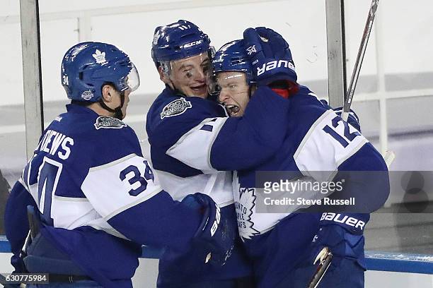 Toronto Maple Leafs right wing Connor Brown celebrates his goal with Auston Matthews and Toronto Maple Leafs center Zach Hyman as the Toronto Maple...