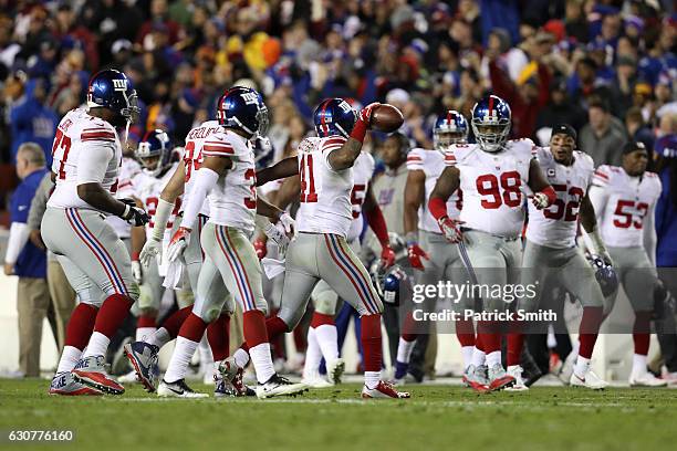 Cornerback Dominique Rodgers-Cromartie of the New York Giants reacts after intercepting the ball against the Washington Redskins in the fourth...
