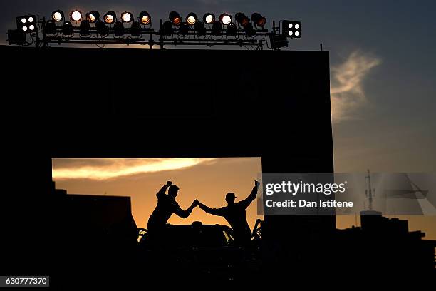 Christian Lavieille of France and Team Land Cruiser Toyota Auto Body and co-driver Jean-Pierre Garcin of France stand on their VDJ200 Toyota car and...