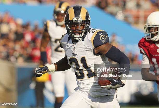 Safety Maurice Alexander of the Los Angeles Rams returns his pass interception against the Arizona Cardinals in the second quarter at Los Angeles...