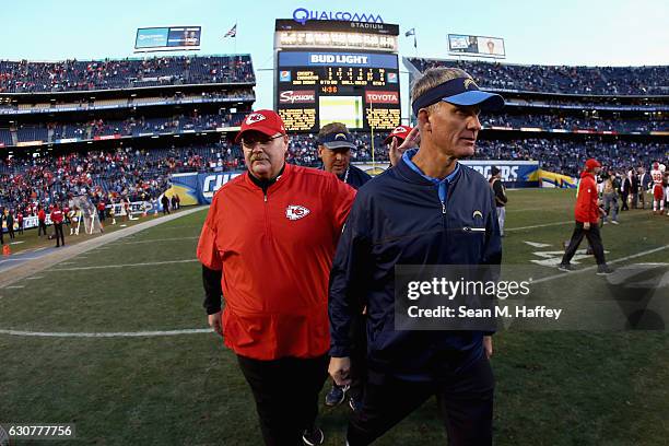 Head coach Andy Reid of the Kansas City Chiefs pats head coach Mike McCoy of the San Diego Chargers on the back as they leave the field following a...