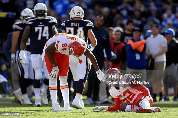 Demetrius Harris looks to Dadi Nicolas of the Kansas City Chiefs after he was injured during the first half of a game against the San Diego Chargers...