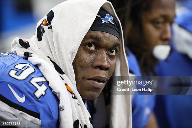 Ezekiel Ansah of the Detroit Lions looks up at the score board in the closing minutes of the game against the Green Bay Packers at Ford Field on...