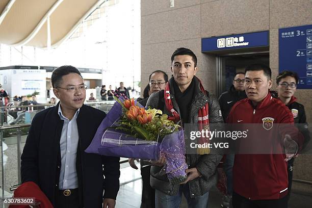 Uzbek footballer Odil Ahmedov arrives at the airport on January 2, 2017 in Shanghai, China. Oscar and Odil Ahmedov join China super league football...