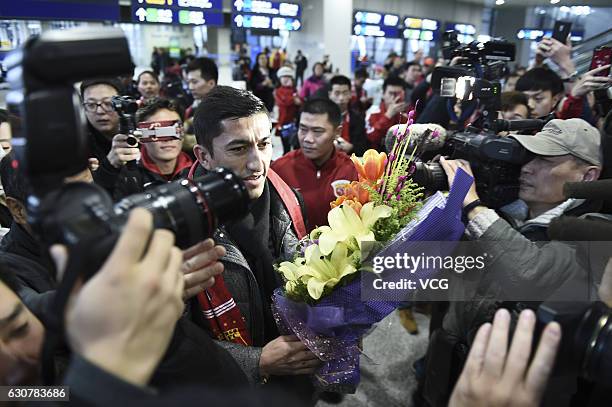 Uzbek footballer Odil Ahmedov arrives at the airport on January 2, 2017 in Shanghai, China. Oscar and Odil Ahmedov join China super league football...