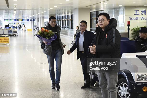 Uzbek footballer Odil Ahmedov arrives at the airport on January 2, 2017 in Shanghai, China. Oscar and Odil Ahmedov join China super league football...