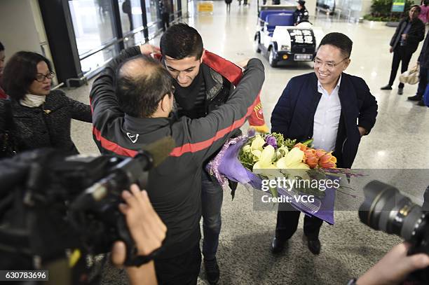 Uzbek footballer Odil Ahmedov arrives at the airport on January 2, 2017 in Shanghai, China. Oscar and Odil Ahmedov join China super league football...