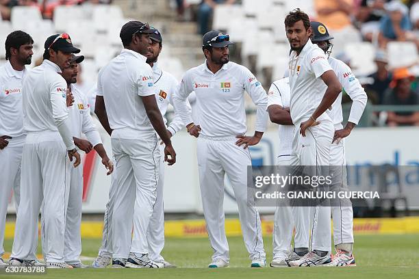 Sri Lanka bowler Suranga Lakmal and players celebrate the dismissal of South African batsman Stephen Cook during the second Test between South Africa...