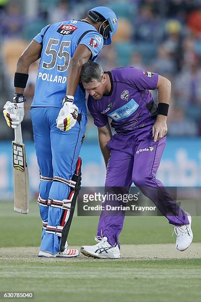Kieron Pollard of the Adelaide Strikers stands his ground as Dan Christian of the Hobart Hurricanes fields the ball during the Big Bash League match...