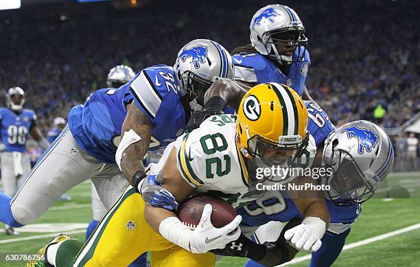 Green Bay Packers tight end Richard Rodgers is tackled by Detroit Lions middle linebacker Tahir Whitehead during the first half of an NFL football...