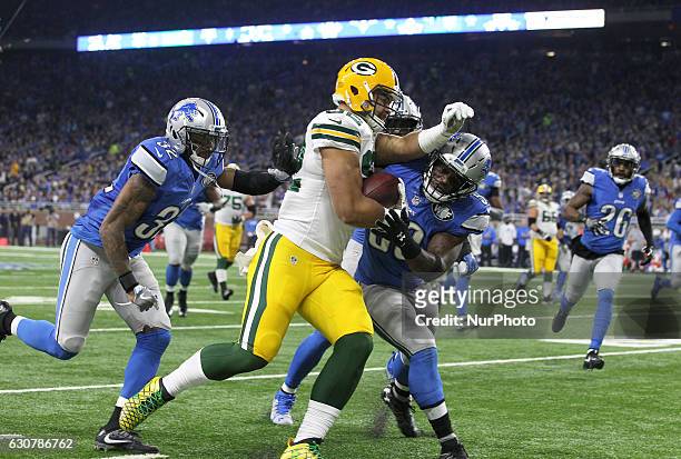Green Bay Packers tight end Richard Rodgers is tackled by Detroit Lions middle linebacker Tahir Whitehead during the first half of an NFL football...