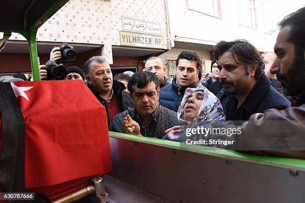 Mother of Fatih Cakmak, a security guard and a victim of an attack by a gunman at Reina nightclub, reacts during his funeral on, January 2, 2017 in...