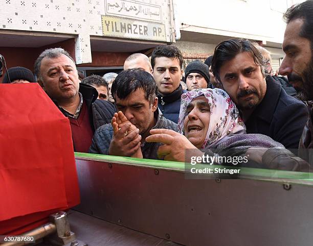 Mother of Fatih Cakmak, a security guard and a victim of an attack by a gunman at Reina nightclub, reacts during his funeral on, January 2, 2017 in...
