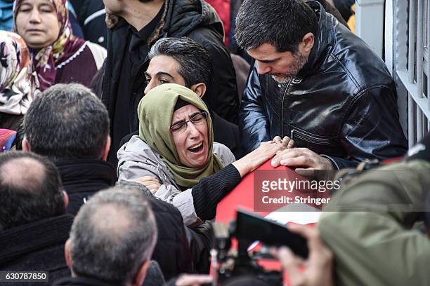 Relatives and friends of Fatih Cakmak, a security guard and a victim of an attack by a gunman at Reina nightclub, mourn during his funeral on,...