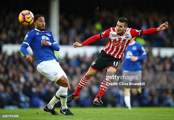 Ashley Williams of Everton attempts to block Dusan Tadic of Southampton shot during the Premier League match between Everton and Southampton at...
