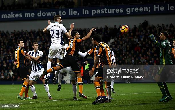 Gareth McAuley of West Bromwich Albion beats Curtis Davies of Hull City to score his sides second goal with a header during the Premier League match...