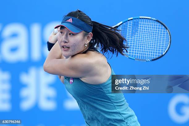 Ying-Ying Duan of China returns a shot during the match against Agnieszka Radwanska of Poland during Day 2 of 2017 WTA Shenzhen Open at Longgang...