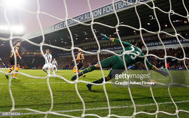James Morrison of West Bromwich Albion scores his sides third goal past David Marshall of Hull City during the Premier League match between West...