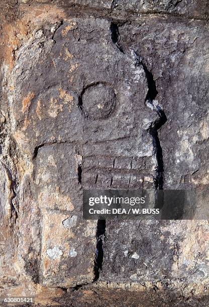 Relief depicting a skull on the wall of the Tzompantli , Chichen Itza , Yucatan, Mexico. Mayan civilisation, 10th-13th century.