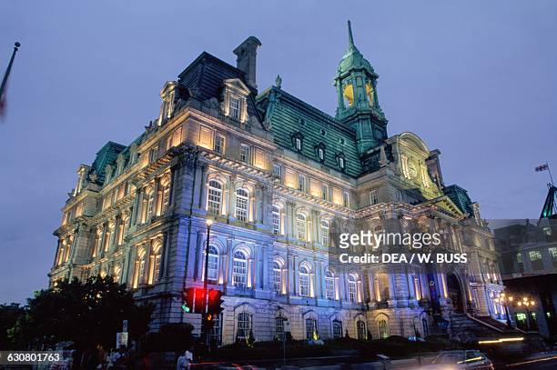 The Hotel de Ville de Montreal , built in the Second Empire style, at night, Quebec, Canada.