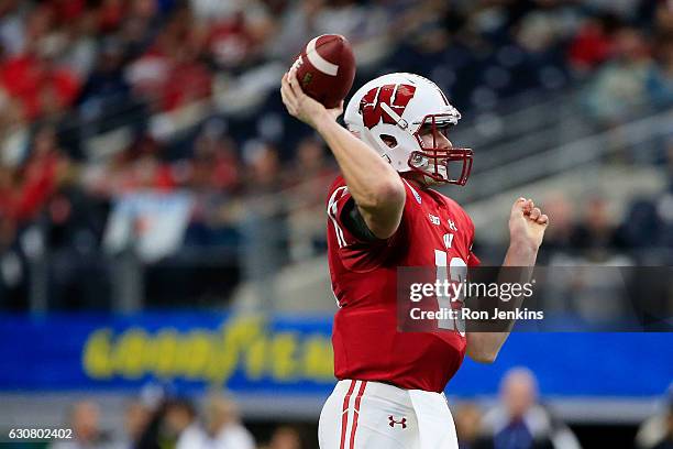 Bart Houston of the Wisconsin Badgers throws in the first quarter during the 81st Goodyear Cotton Bowl Classic between Western Michigan and Wisconsin...