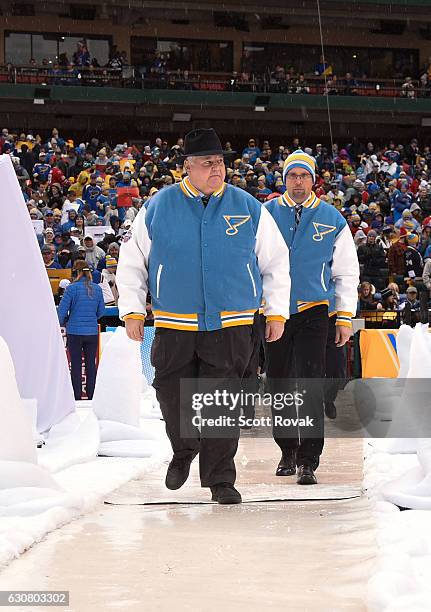 Head Coach Ken Hitchcock and Assistant Coach Mike Yeo of the St. Louis Blues head to the ice prior to the 2017 Bridgestone NHL Winter Classic at...