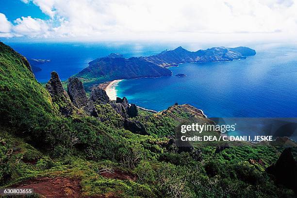 Mountain ranges with vegetation, Haatuatua bay, aerial view, Nuku Hiva, Marquesas islands, French Polynesia.