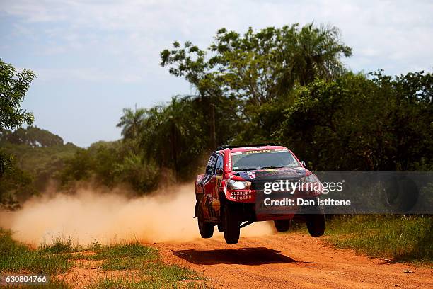 Giniel De Villiers of South Africa and Toyota Gazoo Racing drives with co-driver Dirk Von Zitzewitz of Germany in the Hilux Toyota car in the Classe...