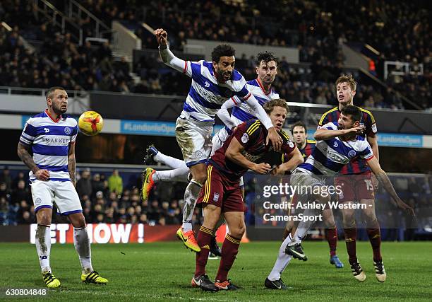 Ipswich Town's Christophe Berra battles with Queens Park Rangers' James Perch during the Sky Bet Championship match between Queens Park Rangers and...