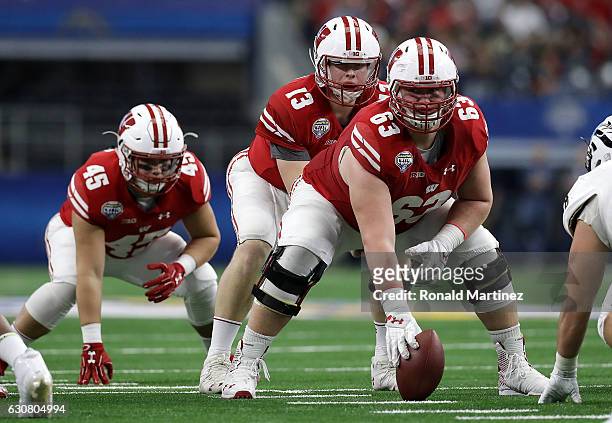 Bart Houston of the Wisconsin Badgers calls a play before the snap during the 81st Goodyear Cotton Bowl Classic between Western Michigan and...