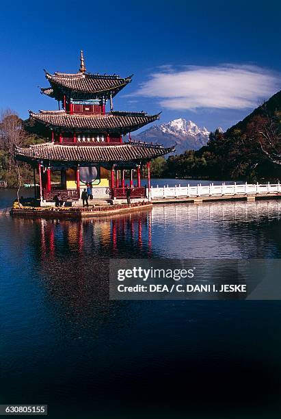 Pagoda on the shores of Black dragon pool, Jade spring park, Lijiang , Yunnan, China.