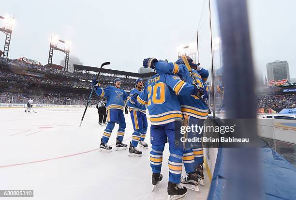 Patrik Berglund of the St. Louis Blues celebrates with teammates Colton Parayko, Ryan Reaves, and Alexander Steen after scoring in the second period...