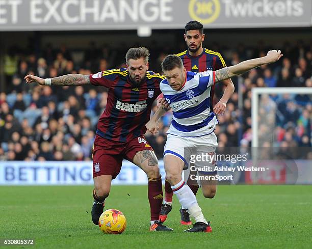 Queens Park Rangers' Jamie Mackie battles for possession with Ipswich Town's Luke Chambers during the Sky Bet Championship match between Queens Park...