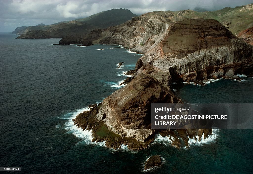 Rocky coast of Motu Mokoe, island of Ua Pou...