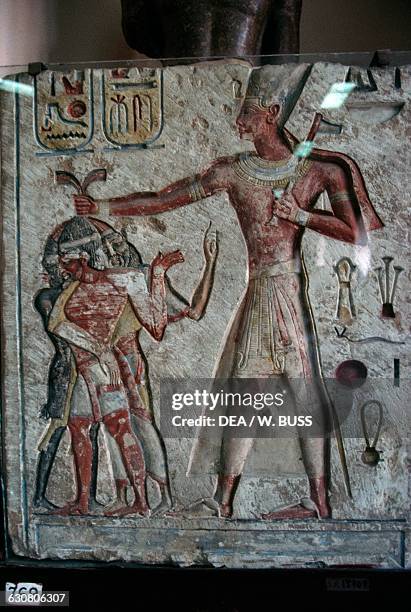 Relief depicting Ramesses II, subduing the enemies by pulling their hair, 1290-1224 BC, Egypt. Egyptian civilisation, New Kingdom, Dynasty XIX....
