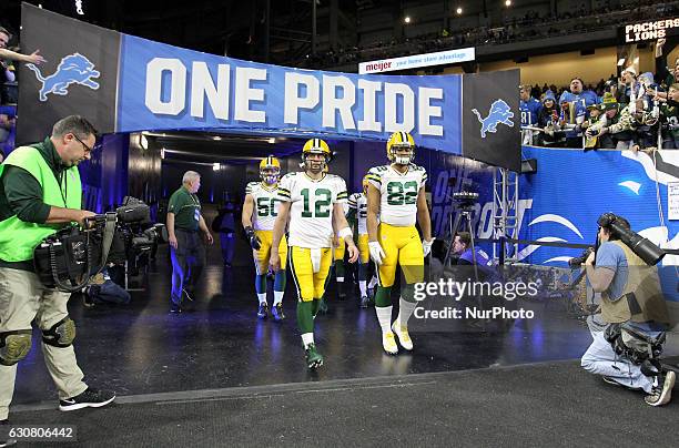 Green Bay Packers quarterback Aaron Rodgers , tight end Richard Rodgers and inside linebacker Blake Martinez walk out the tunnel for pre-game...