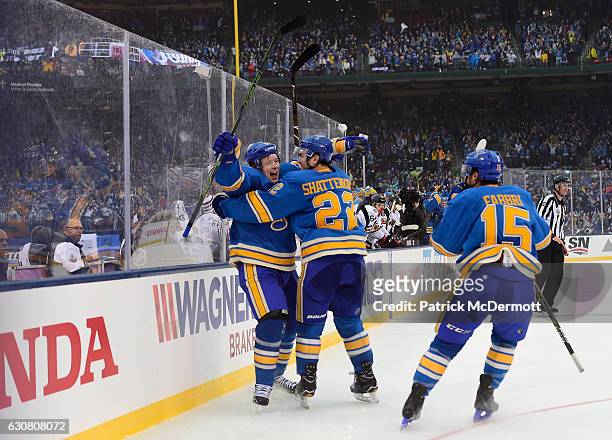 Vladimir Tarasenko of the St. Louis Blues celebrates his goal against the Chicago Blackhawks with teammates Kevin Shattenkirk and Robby Fabbri during...
