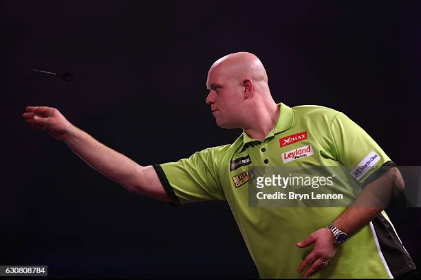Michael van Gerwen of The Netherlands throws against Gary Anderson of Great Britain during the final of the 2017 William Hill PDC World Darts...