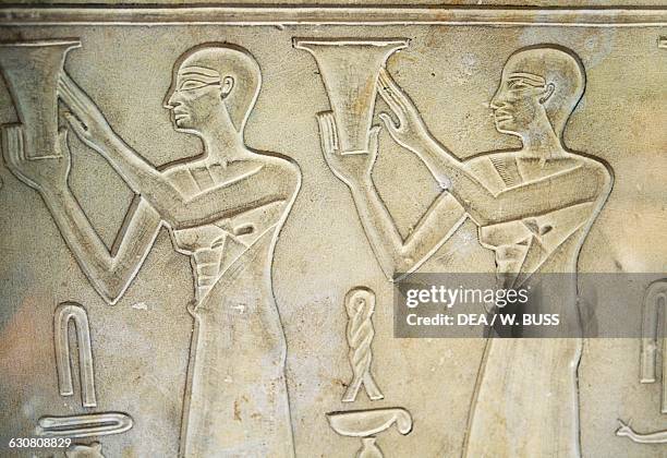 Offerings bearers, bas-relief on the sarcophagus of Princess Kawit, 2050 BC, from the Temple of Mentuhotep II, Deir el-Bahri, Egypt. Egyptian...