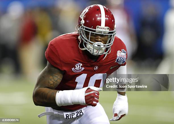 Alabama Crimson Tide linebacker Reuben Foster warms up prior to the Chick-Fil-A Peach Bowl football game between the Alabama Crimson Tide and...