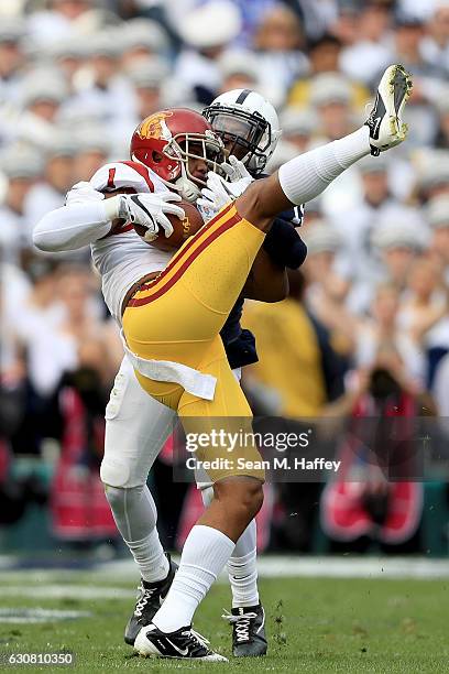 Wide receiver Darreus Rogers of the USC Trojans makes a reception against cornerback Grant Haley of the Penn State Nittany Lions in the first half of...