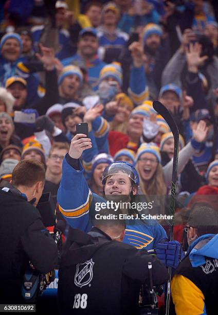 Vladimir Tarasenko of the St. Louis Blues takes a selfie photo with the fans after the 2017 Bridgestone NHL Winter Classic at Busch Stadium on...