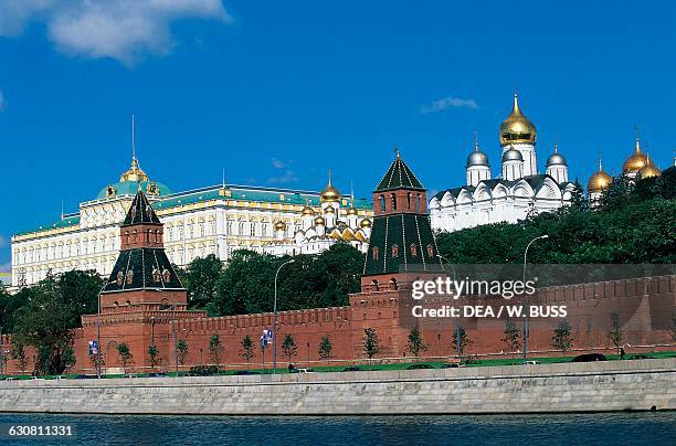 Towers and walls of the Kremlin, Ivan the Great bell tower, Cathedral of the Annunciation and Grand Palace, view from the Moskva River, Moscow...