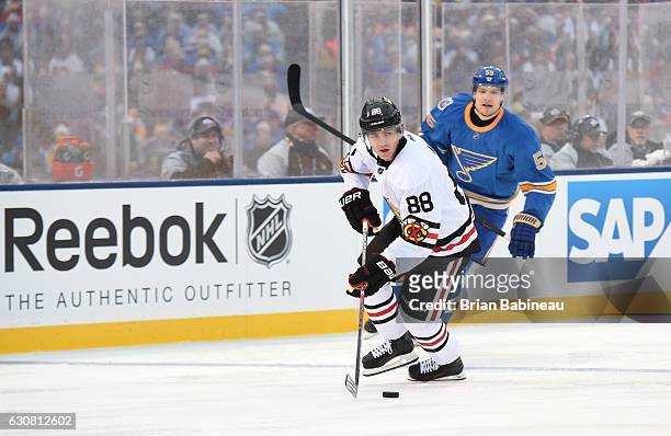 Patrick Kane of the Chicago Blackhawks controls the puck against the St. Louis Blues during the 2017 Bridgestone NHL Winter Classic at Busch Stadium...