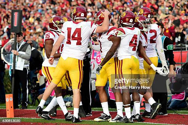 Wide receiver Darreus Rogers of the USC Trojans celebrates with teammates after making a 3-yard touchdown reception against the Penn State Nittany...