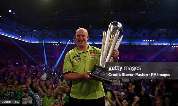 Michael van Gerwen celebrates winning with Sid Waddell trophy during day fifteen of the William Hill World Darts Championship at Alexandra Palace,...